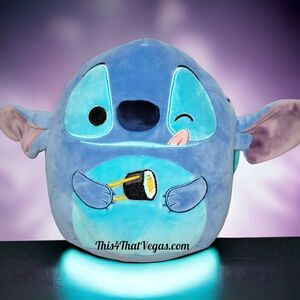 Squishmallow winking STITCH eating sushi